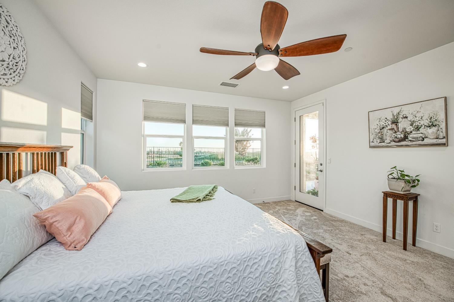 4534 Hillside Road Madera, CA 93636 - Photo 45 of 92 a bedroom with a large bed and a window