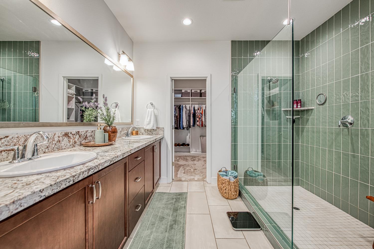 4534 Hillside Road Madera, CA 93636 - Photo 46 of 92 a bathroom with a granite countertop sink mirror and shower