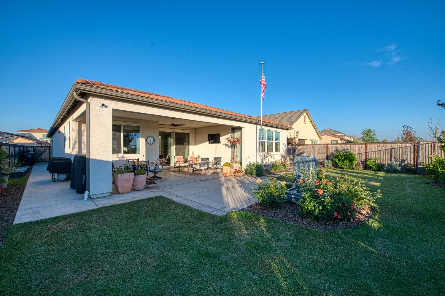 4534 Hillside Road Madera, CA 93636 - Photo 57 of 92 a view of a house with backyard porch and sitting area