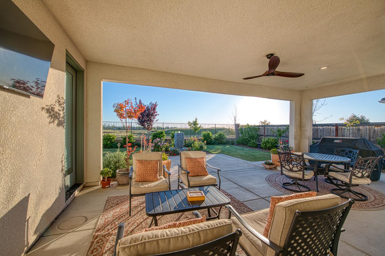 4534 Hillside Road Madera, CA 93636 - Photo 83 of 92 a living room with patio furniture and a flat screen tv