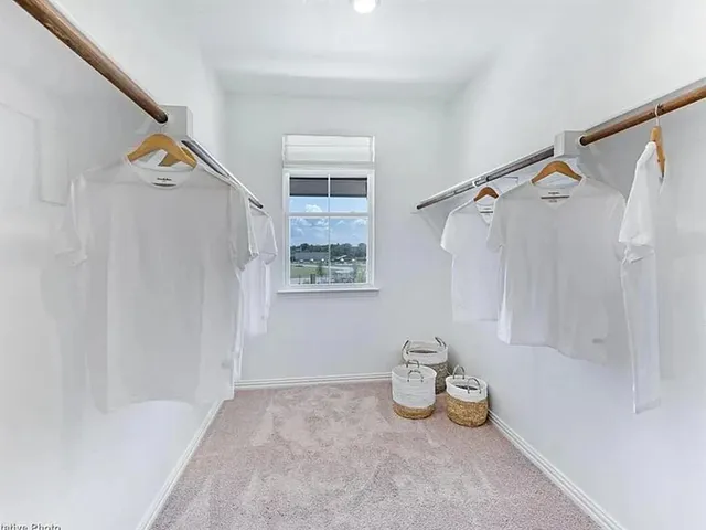 a view of a bed room and a window