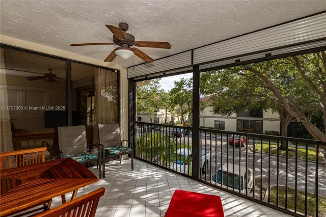 a view of a balcony with furniture