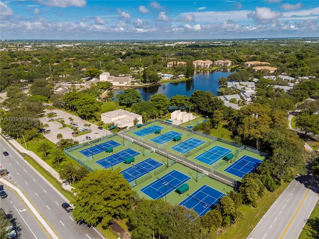 an aerial view of residential houses with outdoor space and garden