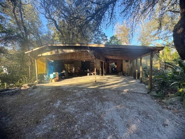 4547 C R 692 Webster, FL 33597 - Photo 25 of 26 a view of a house with a yard and tree