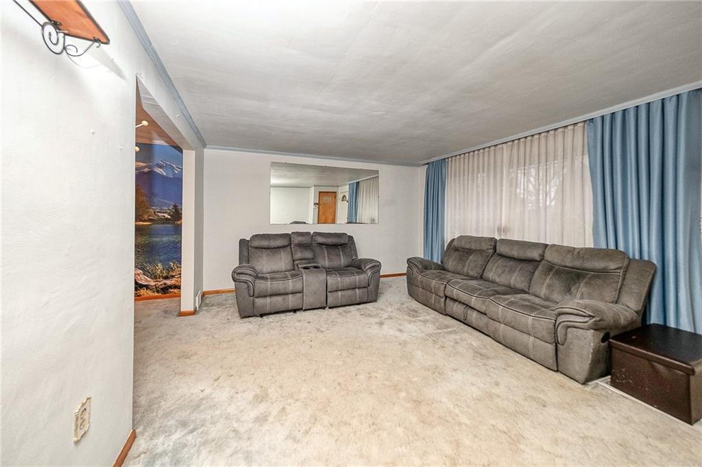 609 Regency Drive Pittsburgh, PA 15239 - Photo 13 of 32 a living room with furniture and a couch