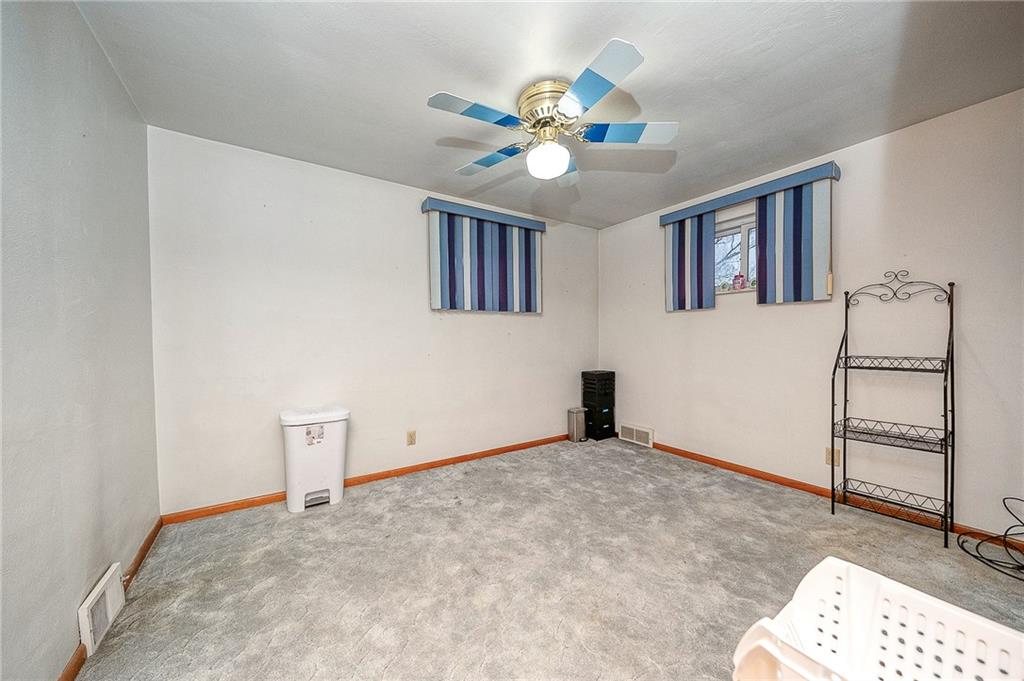 609 Regency Drive Pittsburgh, PA 15239 - Photo 27 of 32 a view of an empty room with a ceiling fan