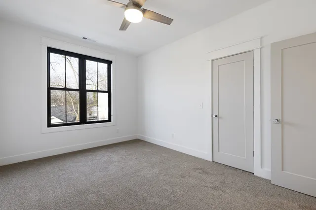 a bathroom with a toilet a sink a mirror and bathtub