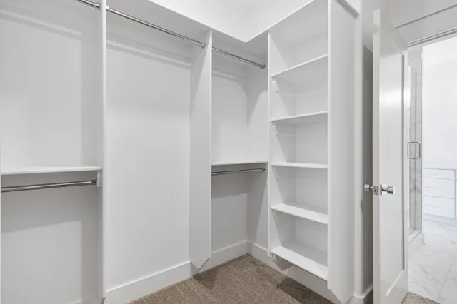 a view of an empty walk in closet