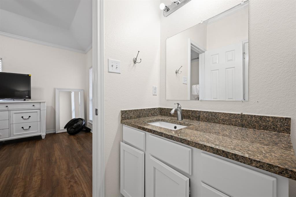 7 St Charles Place Midlothian, TX 76065 - Photo 19 of 27 a bathroom with a sink and a mirror