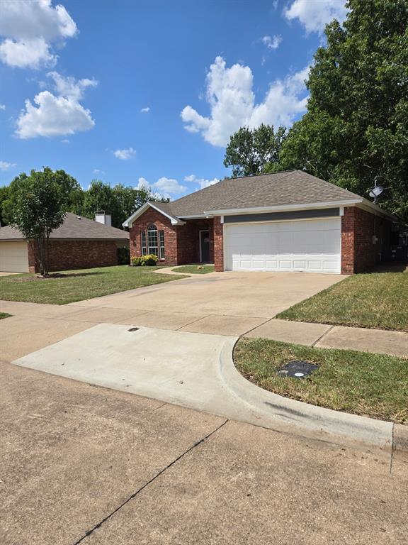 7 St Charles Place Midlothian, TX 76065 - Photo 2 of 27 a front view of a house with a yard and garage