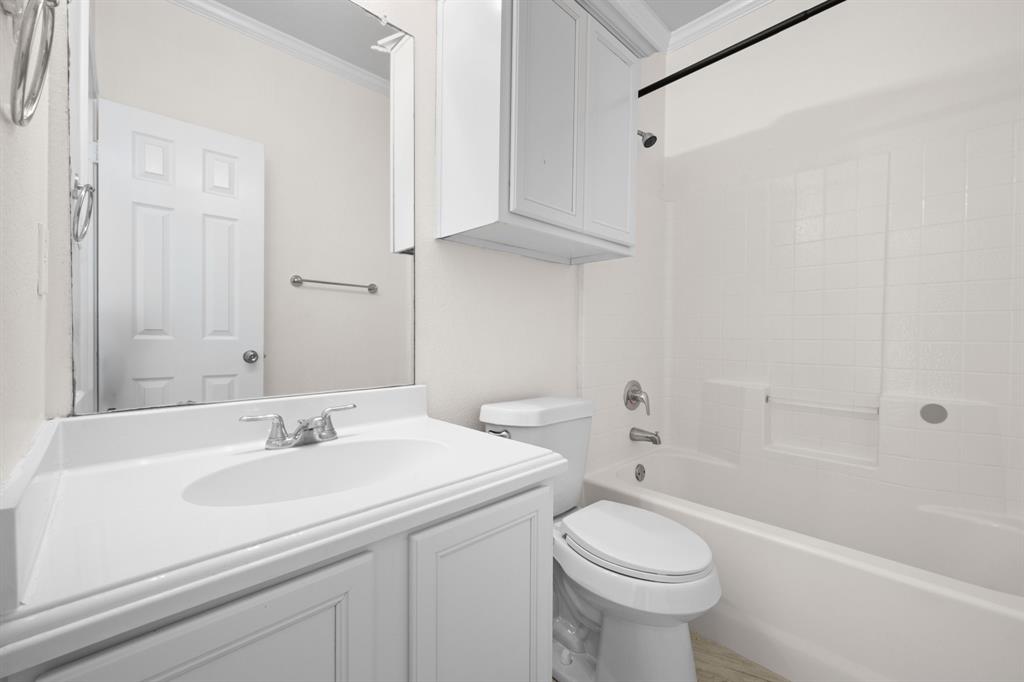 7 St Charles Place Midlothian, TX 76065 - Photo 21 of 27 a bathroom with a sink a toilet and shower