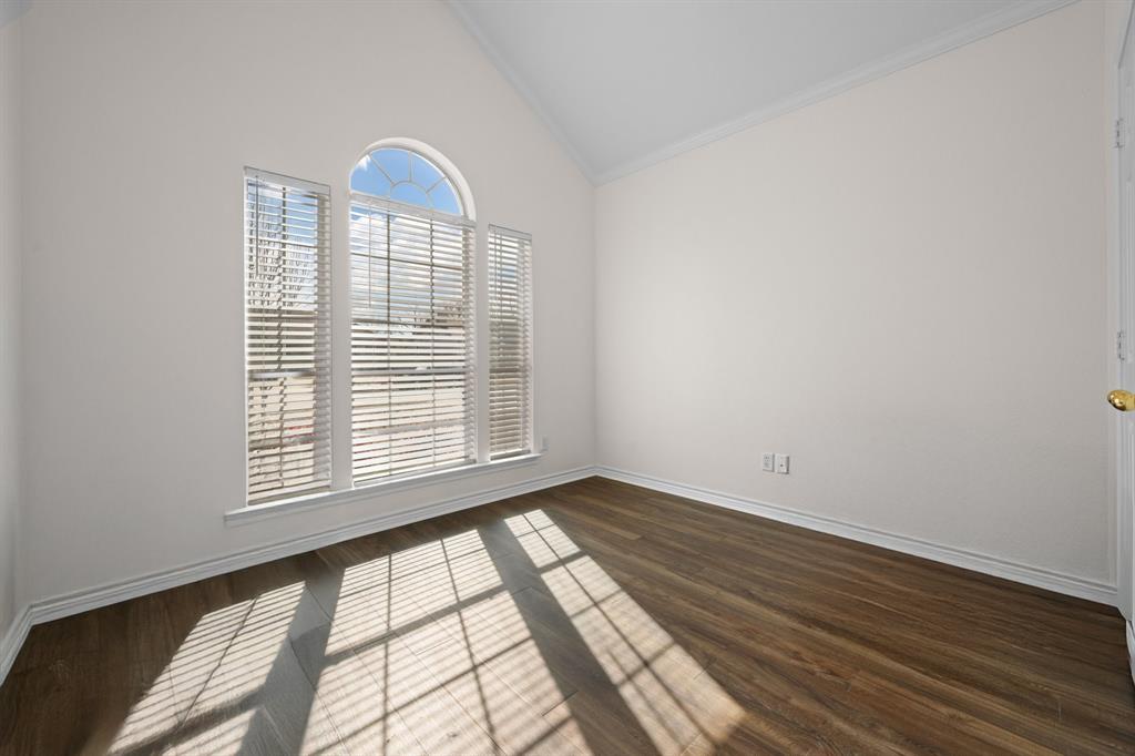 7 St Charles Place Midlothian, TX 76065 - Photo 22 of 27 a view of an empty room with wooden floor and a window