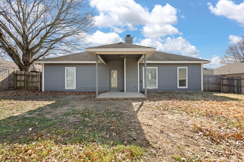 7 St Charles Place Midlothian, TX 76065 - Photo 24 of 27 a front view of a house with a yard and garage