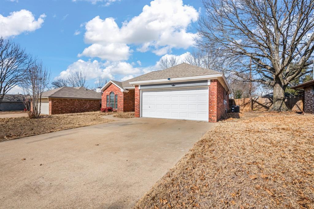 7 St Charles Place Midlothian, TX 76065 - Photo 4 of 27 a front view of a house with a yard covered with snow