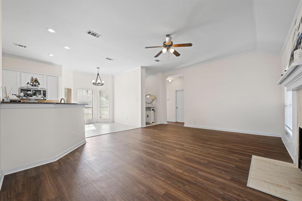 7 St Charles Place Midlothian, TX 76065 - Photo 8 of 27 a view of a kitchen with wooden floor and a kitchen space
