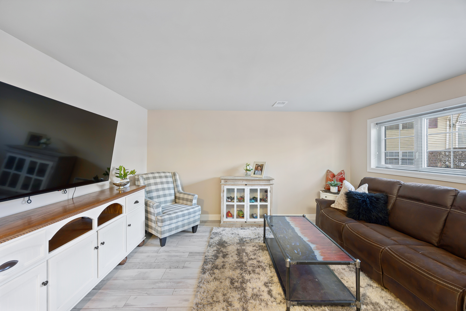 7616 West Saint Francis Road Frankfort, IL 60423 - Photo 15 of 16 a living room with furniture and a flat screen tv