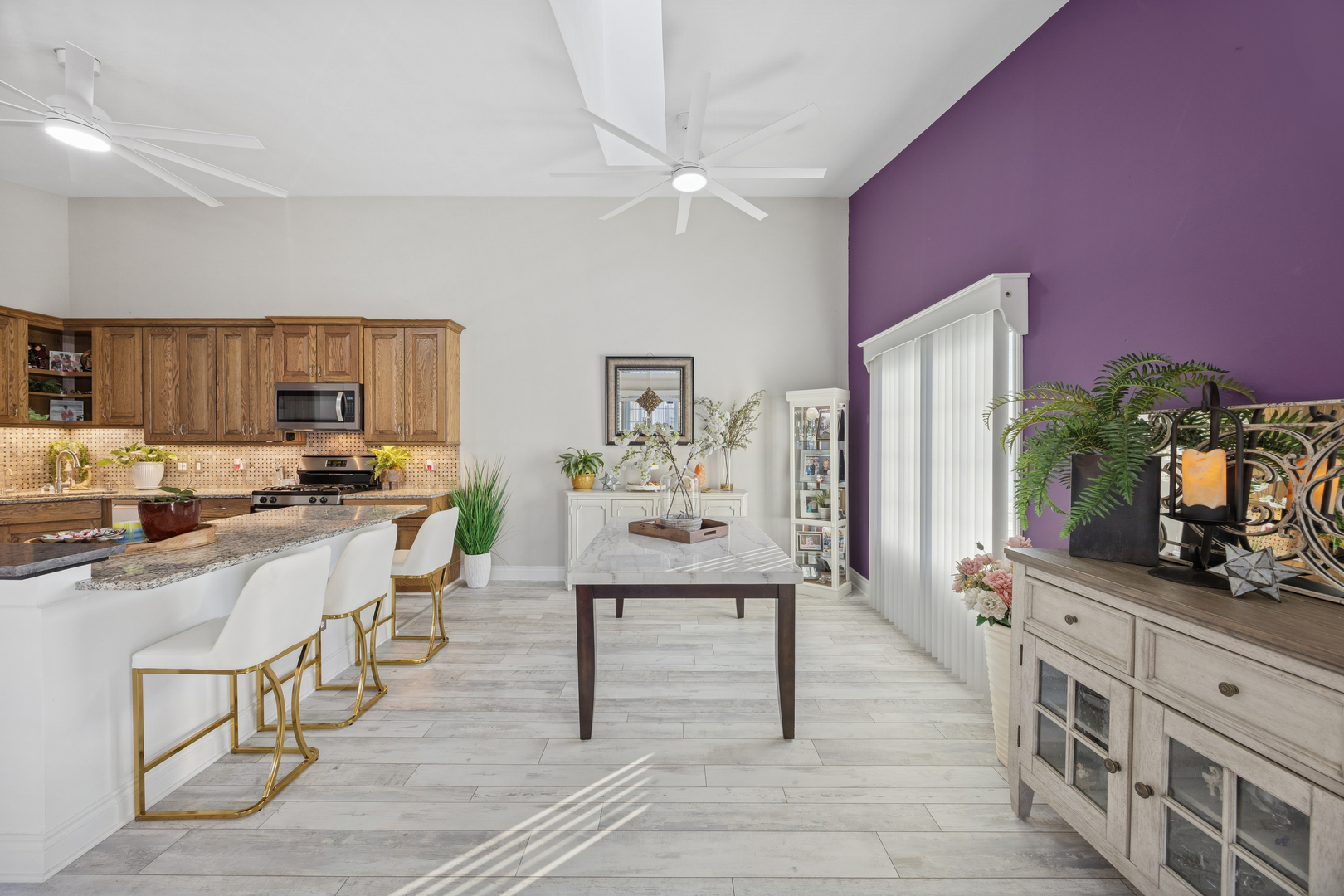 7616 West Saint Francis Road Frankfort, IL 60423 - Photo 3 of 16 a living room with furniture a flat screen tv and kitchen view