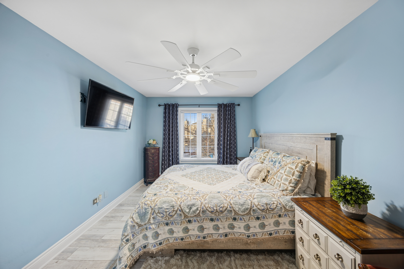 7616 West Saint Francis Road Frankfort, IL 60423 - Photo 8 of 16 a bedroom with a bed and a flat screen tv