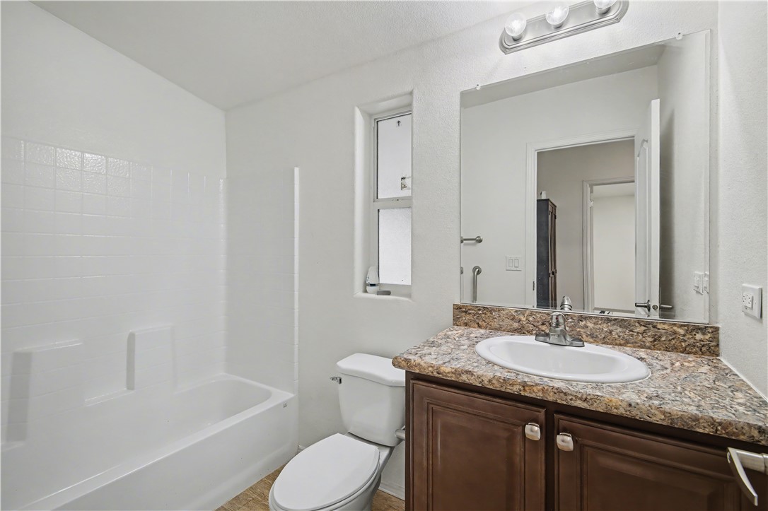 3058 West Carmichael Road Golden Valley, AZ 86413 - Photo 11 of 36 Bathroom featuring vanity and shower / bathtub combination