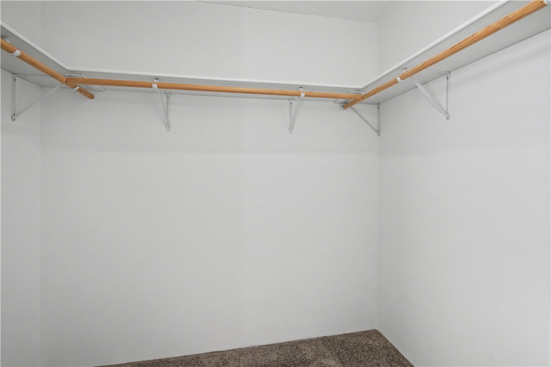 3058 West Carmichael Road Golden Valley, AZ 86413 - Photo 14 of 36 Spacious closet with carpet