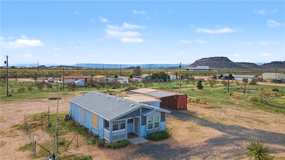 3058 West Carmichael Road Golden Valley, AZ 86413 - Photo 20 of 36 Aerial view of sparsely populated area featuring a mountainous background