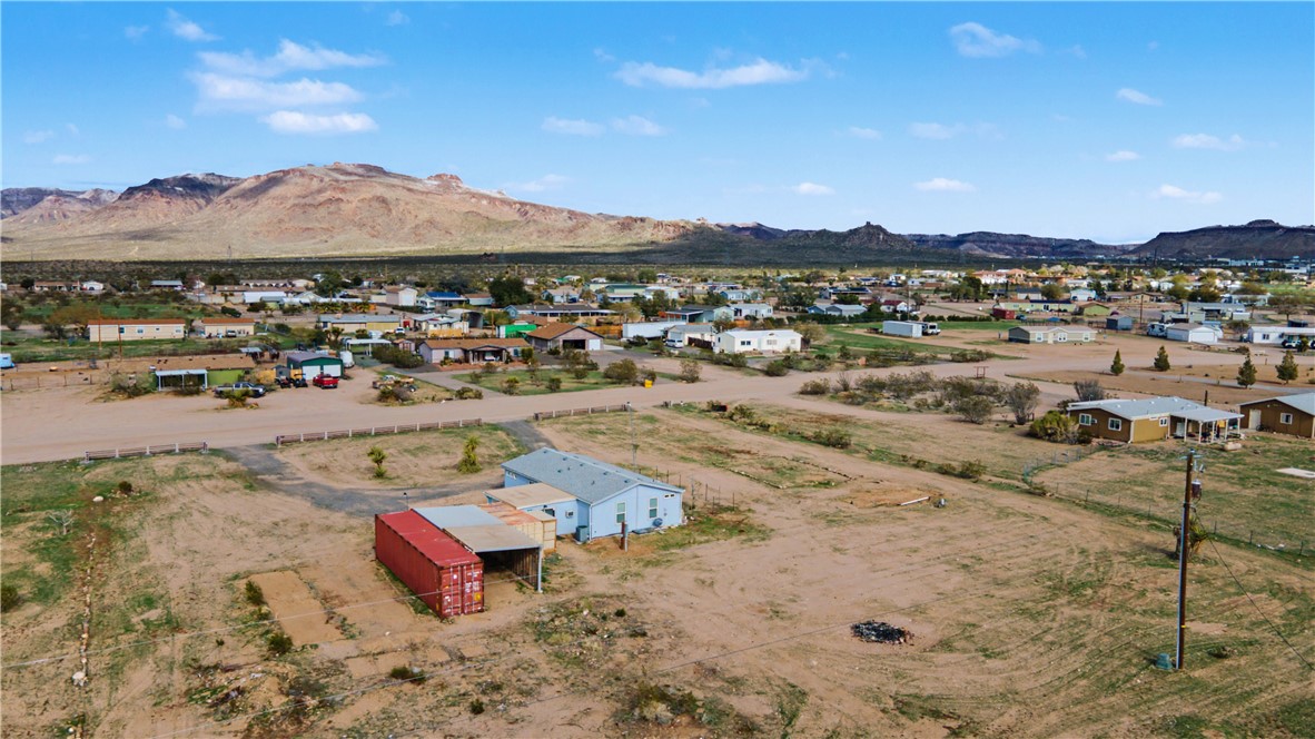 3058 West Carmichael Road Golden Valley, AZ 86413 - Photo 22 of 36 Drone / aerial view of a mountain backdrop