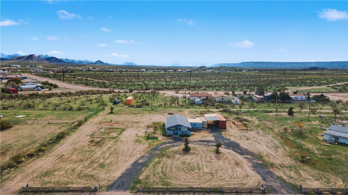 3058 West Carmichael Road Golden Valley, AZ 86413 - Photo 25 of 36 Aerial view of sparsely populated area with a mountainous background