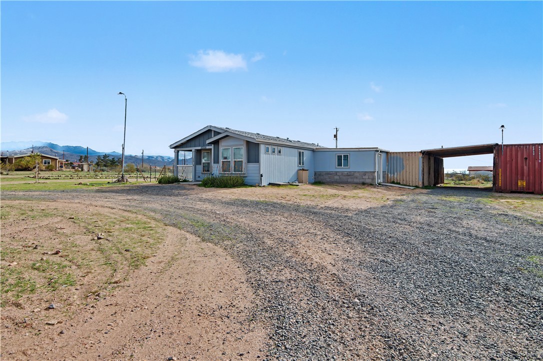 3058 West Carmichael Road Golden Valley, AZ 86413 - Photo 30 of 36 Manufactured / mobile home with gravel driveway and a mountain view