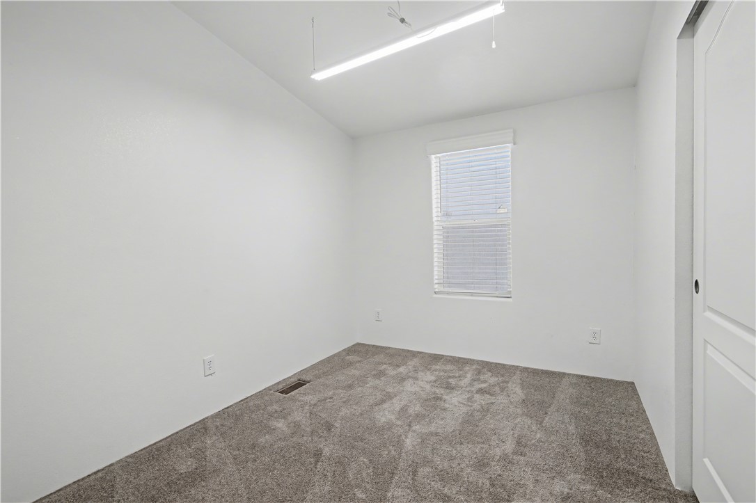 3058 West Carmichael Road Golden Valley, AZ 86413 - Photo 9 of 36 View of carpeted empty room