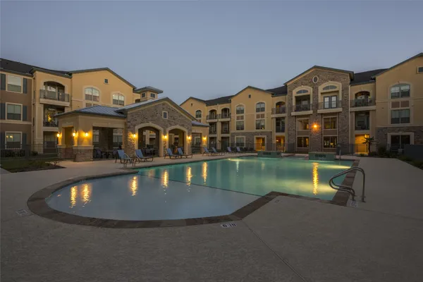 an aerial view of a house with a swimming pool