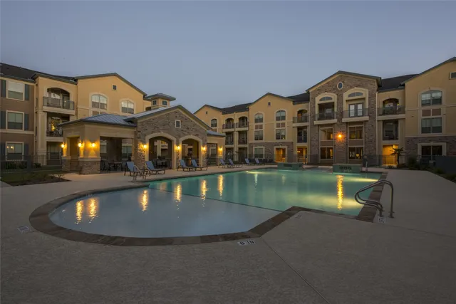 an aerial view of a house with a swimming pool