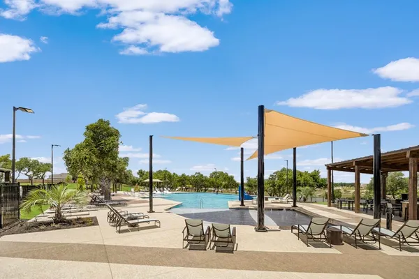 a view of a swimming pool with a patio