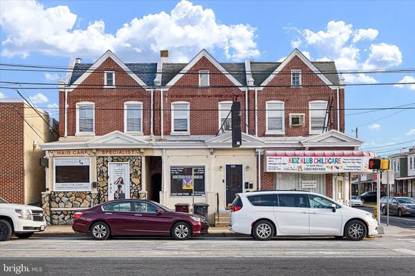 a view of a car parked in front of a building