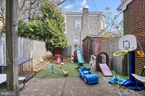 a bedroom with bed and a flat screen tv
