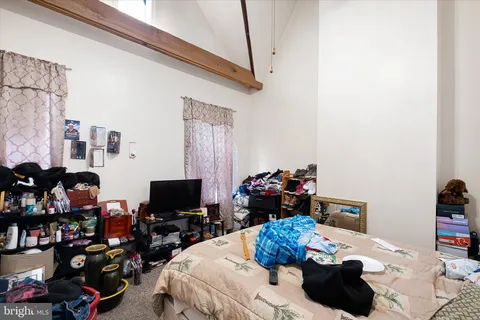 a view of a kitchen with fridge and workspace