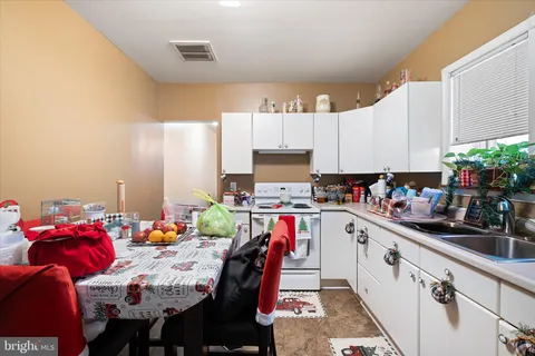 a bathroom with a shower curtain and a sink