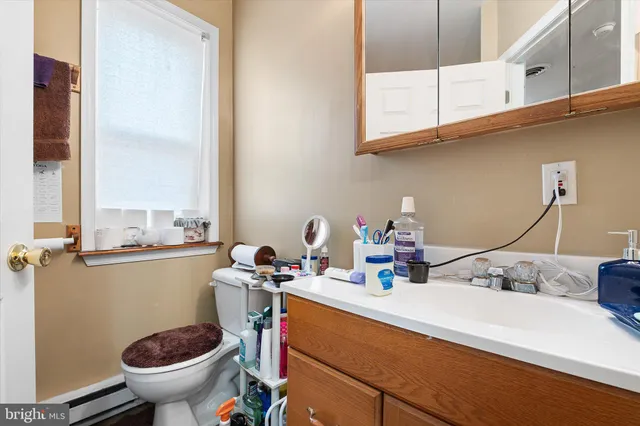 a view of a chairs and table in the balcony