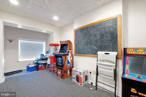 a view of game room with toys and equipment