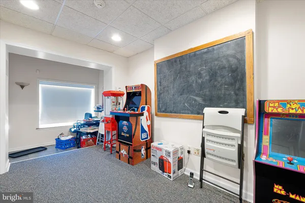 a view of game room with toys and equipment