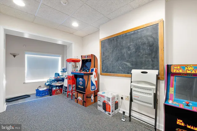 a view of game room with toys and equipment