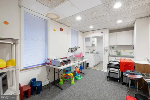 a bathroom with a sink mirror vanity and toilet