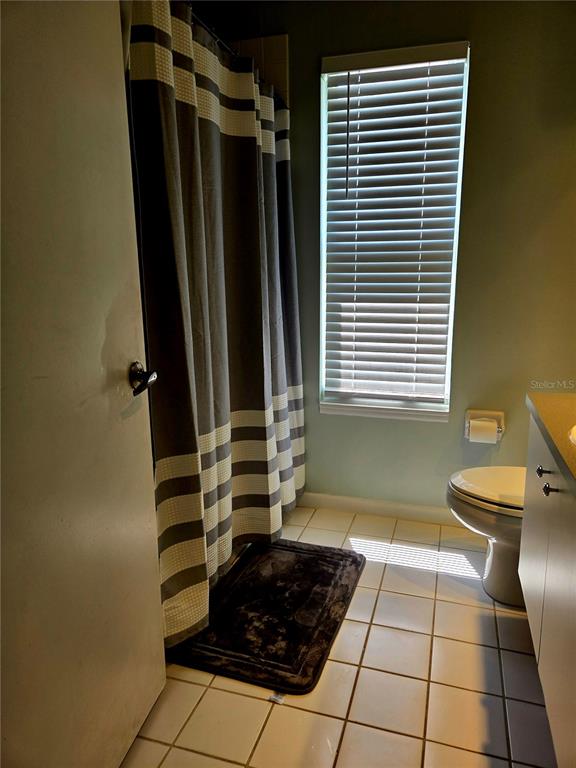 7838 Trail Run Loop New Port Richey, FL 34653 - Photo 29 of 36 a room with a black white checkered floor