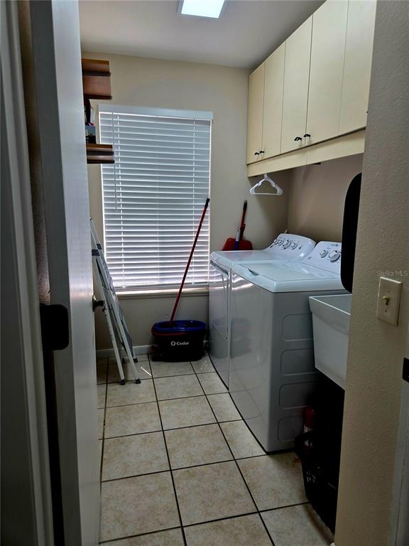 7838 Trail Run Loop New Port Richey, FL 34653 - Photo 30 of 36 a room with washing machine and stairs