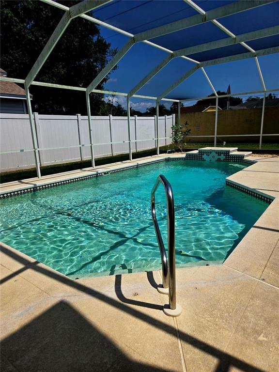 7838 Trail Run Loop New Port Richey, FL 34653 - Photo 33 of 36 a view of a backyard with table and chairs