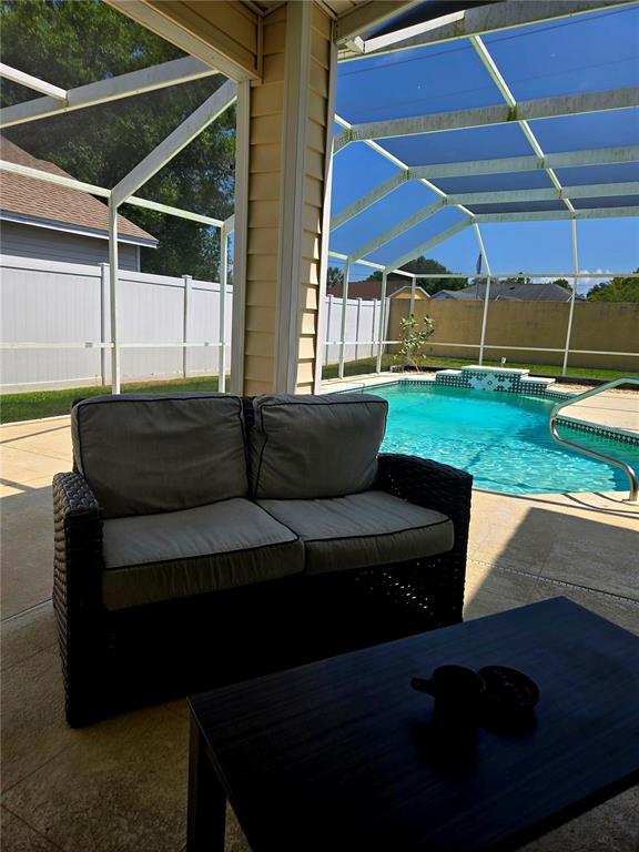 7838 Trail Run Loop New Port Richey, FL 34653 - Photo 35 of 36 a view of patio with couches and a table and chairs