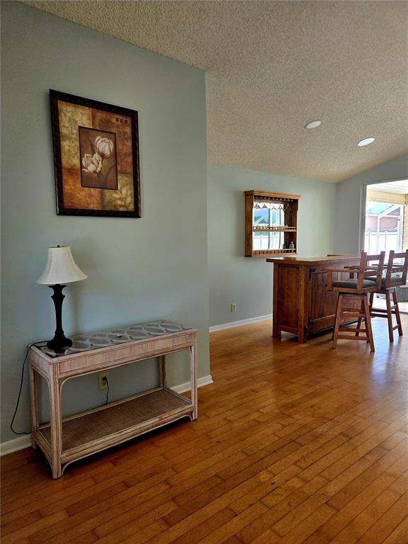 7838 Trail Run Loop New Port Richey, FL 34653 - Photo 4 of 36 a living room with furniture and wooden floor