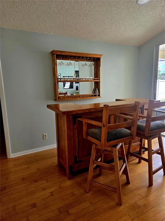 7838 Trail Run Loop New Port Richey, FL 34653 - Photo 5 of 36 a room with furniture and wooden floor