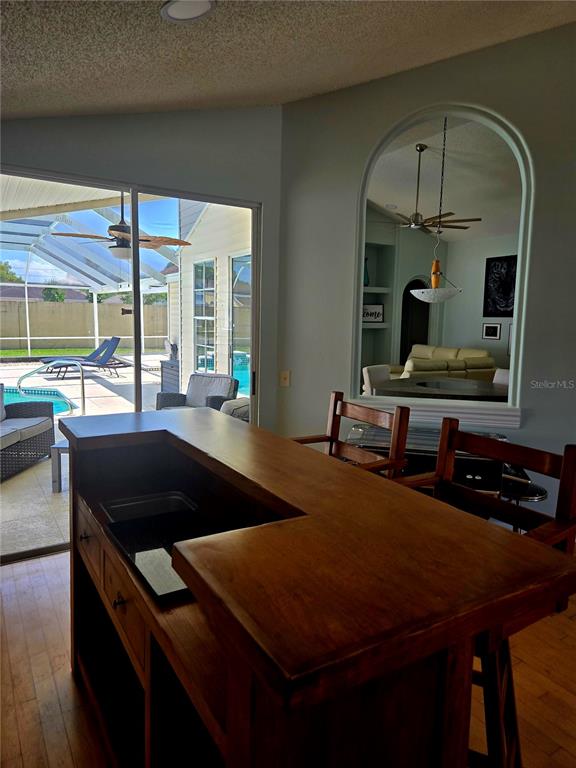 7838 Trail Run Loop New Port Richey, FL 34653 - Photo 6 of 36 a kitchen with a table chairs and a large window