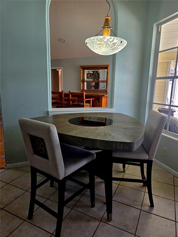 7838 Trail Run Loop New Port Richey, FL 34653 - Photo 7 of 36 a dining room with furniture and window