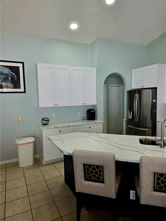 a kitchen with stainless steel appliances a sink stove and refrigerator